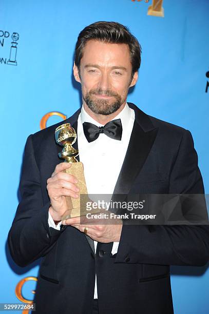 Actor Hugh Jackman, winner Best Actor in a Motion Picture, Comedy or Musical for Les Miserables, posing at the 70th Annual Golden Globe Awards held...