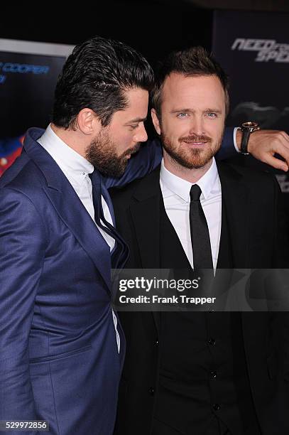 Actors Dominic Cooper and Aaron Paul arrive at the premiere of "Need For Speed" held at the TCL Chinese Theater in Hollywood.