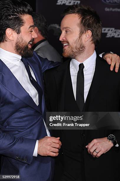 Actors Dominic Cooper and Aaron Paul arrive at the premiere of "Need For Speed" held at the TCL Chinese Theater in Hollywood.