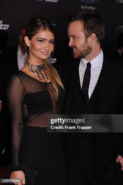 Actor Aaron Paul and Lauren Parsekian arrive at the premiere of "Need For Speed" held at the TCL Chinese Theater in Hollywood.