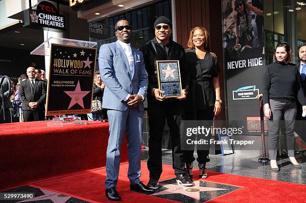 Rapper-actors Sean Combs, LL Cool J and Queen Latifah pose at the ceremony that honored LL Cool J with a Star on the Hollywood Walk of Fame.
