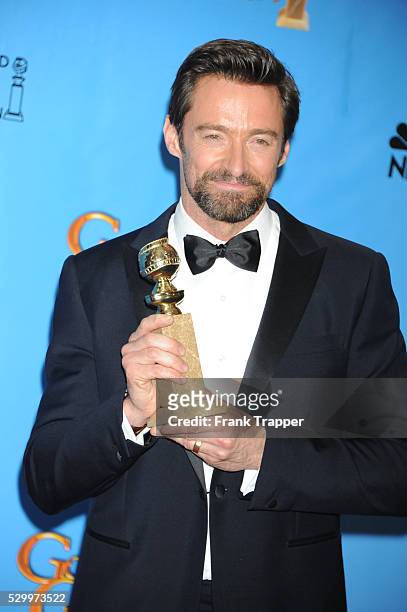 Actor Hugh Jackman, winner Best Actor in a Motion Picture, Comedy or Musical for Les Miserables, posing at the 70th Annual Golden Globe Awards held...