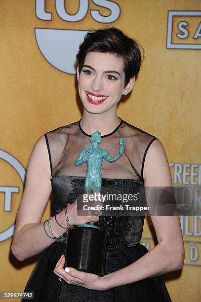 Actress Anne Hathaway, winner of Outstanding Performance by a Female Actor in a Supporting Role for Les Miserables, poseing at the 19th Annual Screen...
