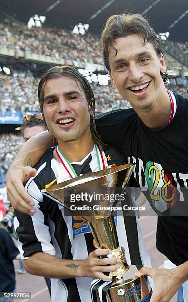 Adrian Mutu and Zlatan Ibrahimovic of Juventus celebrate with the trophy at the end of the last Serie A football match of the season between Juventus...