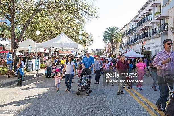 love local:  strolling at palm beach family fun festival - west palm beach stock pictures, royalty-free photos & images