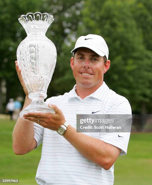 Justin Leonard poses with the trophy after a one-stroke victory at the Fed Ex St. Jude Classic at the TPC Southwind on May 29, 2005 in Memphis,...