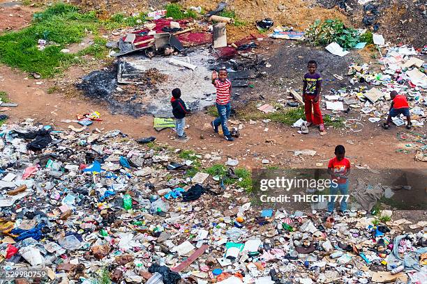 street children playing at a dumpsite - street child stock pictures, royalty-free photos & images