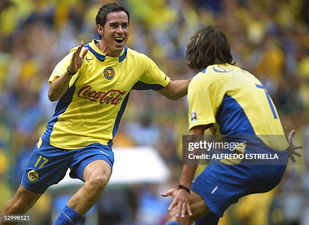 Aaron Padilla de America festeja el tercer gol de su equipo con su companero Claudio "El Piojo" Lopez, ante Tecos de la UAG, en la final del Torneo...