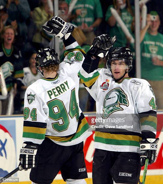 Danny Fritsche of the London Knights celebrates a goal with teammate Corey Perry against the Rimouski Oceanic during the Memorial Cup Tournament...