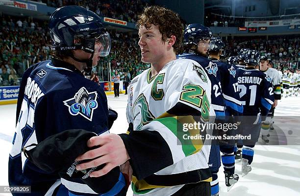 Former Team Canada teammates Danny Syvret of the London Knights and Sidney Crosby of the Rimouski Oceanic shake hands after the Knights defeated...