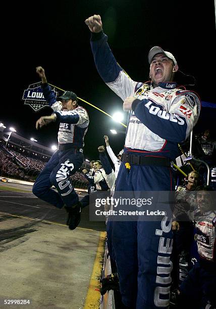 The crew of Jimmie Johnson, driver of the Hendricks Motorsports Lowe's Chevrolet, celebrate after winning the NASCAR Nextel Cup Coca-Cola 600 on May...