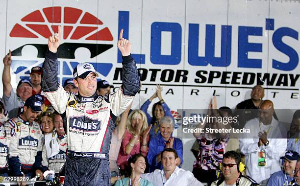 Jimmie Johnson, driver of the Hendricks Motorsports Lowe's Chevrolet, celebrates after winning the NASCAR Nextel Cup Coca-Cola 600 on May 29, 2005 at...
