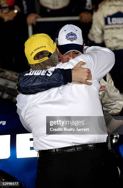 Jimmie Johnson , driver of the Lowe's Chevrolet, hugs team owner Rick Hendrix in Victory Lane after winning the NASCAR Nextel Cup Series Coca-Cola...