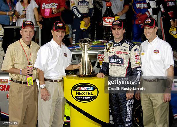 Jimmie Johnson, driver of the Lowe's Chevrolet, poses with Senator Bill Frist in Victory Lane after winning the NASCAR Nextel Cup Series Coca-Cola...