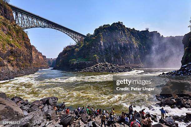 tourists at the boiling pot lookout - victoria falls stock pictures, royalty-free photos & images