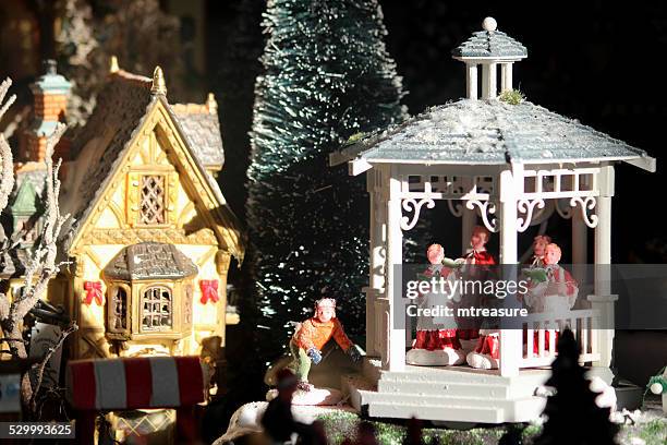 model christmas village image, children's choir / gazebo / band-stand, people, winter-scene - musikestrad bildbanksfoton och bilder