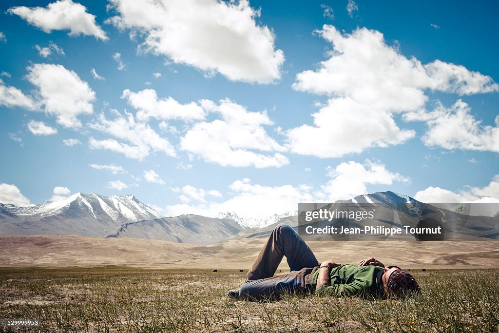 A man resting on the Pamir plateau, Tajikistan