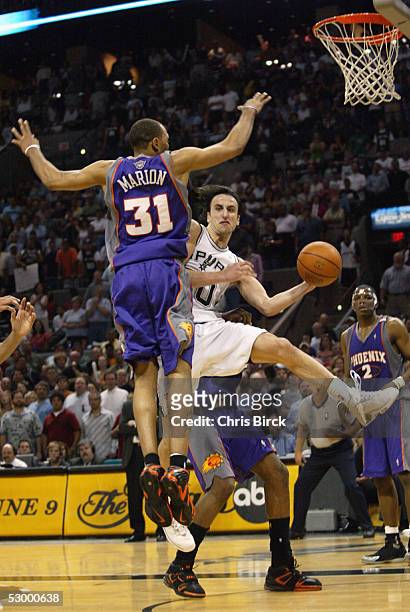 Manu Ginobili of the San Antonio Spurs looks for someone to pass to around Shawn Marion of the Phoenix Suns in Game four of the Western Conference...