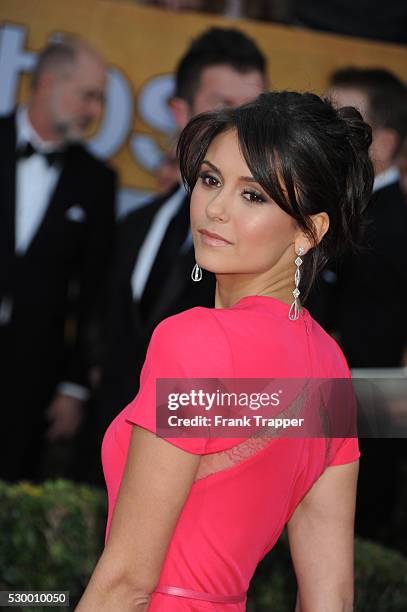 Actress Nina Dobrev arrives at the 19th Annual Screen Actors Guild Awards held at The Shrine Auditorium .