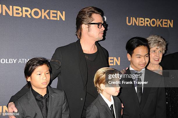 Actor Brad Pitt posing with his children Pax Jolie-Pitt, Shiloh Jolie-Pitt, and Maddox Jolie-Pitt and his parents Jane Etta Pitt and William Alvin...