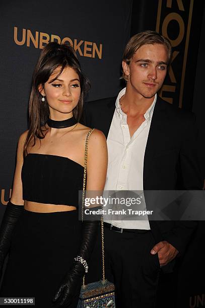 Actress Sophie Dalah and guest arrive at the premiere of "Unbroken" held at The Dolby Theater in Hollywood.