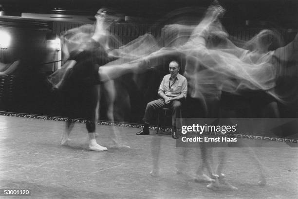 Premium Rates Apply. Russian-born American choreographer George Balanchine watching a dance rehearsal at a studio in New York City, 1960s.