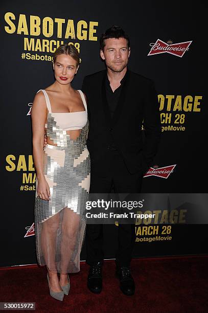 Actor Sam Worthington and Lara Bingle arrive at the premiere of "Sabotage" held at the the Regal Cinemas LA Live.