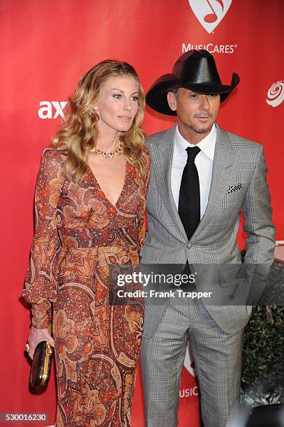 Singers Faith Hill and Tim McGraw arrive at the 2013 MusiCares Person Of The Year Gala Honoring Bruce Springsteen held at the Los Angeles Convention...