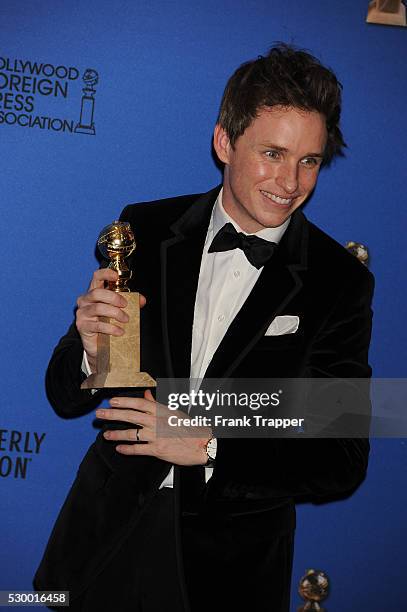 Actor Eddie Redmayne, winner of Best Performance in a Motion Picture - Drama for "The Theory of Everything" posing at the 72nd Annual Golden Globe...