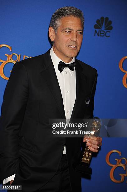 Actor/director George Clooney, recipient of the Cecil B. DeMille Award posing at the 72nd Annual Golden Globe Awards held at the beverly Hilton Hotel.