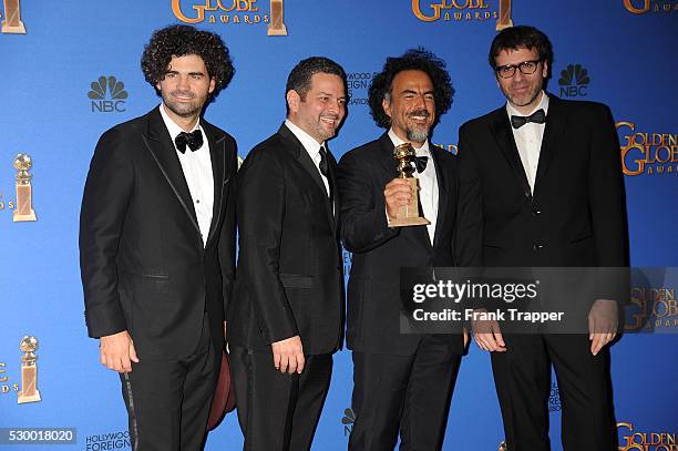 Armando Bo, Nicolss Giacobone, Alejandro Gonzalez Inarritu and Alexander Dinelaris pose with the award for Best Screenplay - Motion Picture...