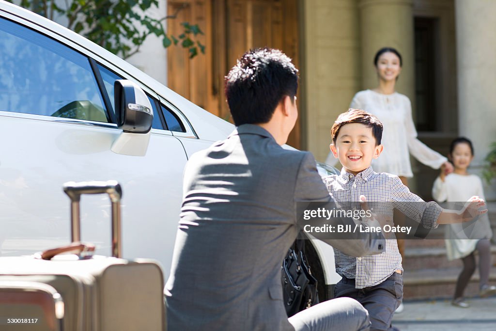 Son greeting returning father