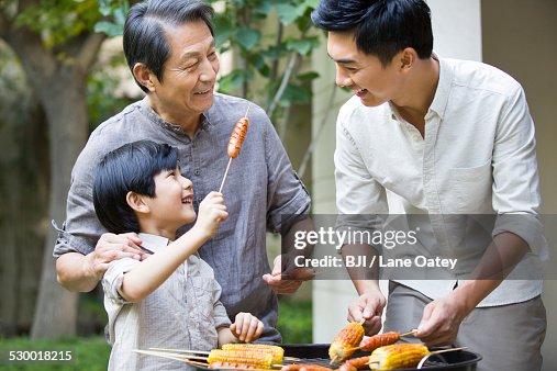 Happy family barbecuing Happy family barbecuing