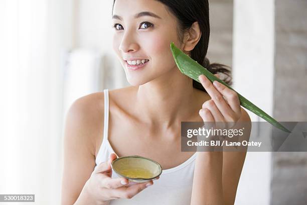 young woman with natural aloe vera - aloe vera gel stock pictures, royalty-free photos & images