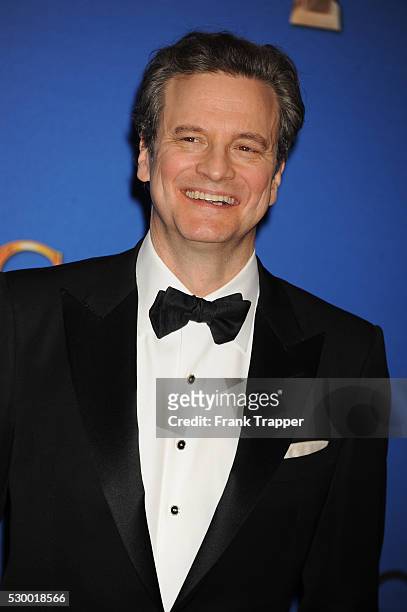 Actor Colin Firth posing in the press room at the 72nd Annual Golden Globe Awards held at the Beverly Hilton Hotel.