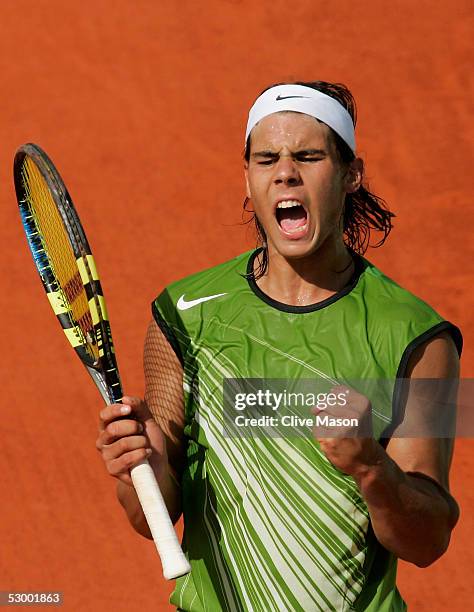 Rafael Nadal of Spain celebrates winning a point during his quarter-final match against David Ferrer of Spain during the ninth day of the French Open...