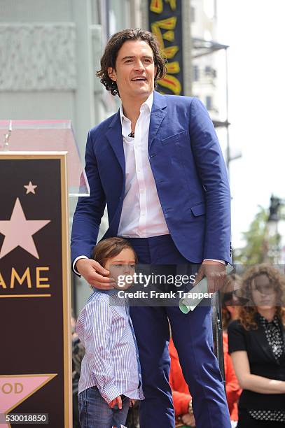 Actor Orlando Bloom pose with his son Flynn at the ceremony that honored him with a Star on the Hollywood Walk of Fame.