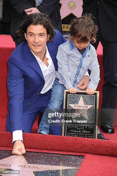 Actor Orlando Bloom and son Flynn pose at the ceremony that honored him with a Star on the Hollywood Walk of Fame.