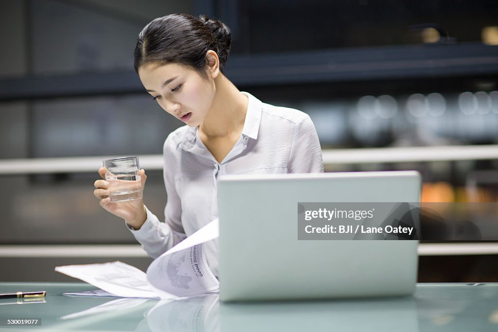 Young businesswoman working in office