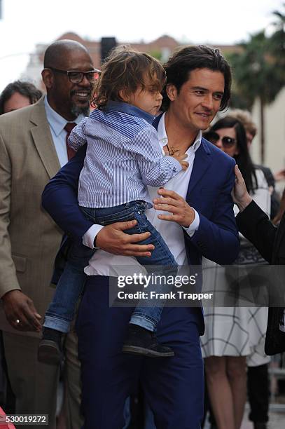 Actor Orlando Bloom and son Flynn pose at the ceremony that honored him with a Star on the Hollywood Walk of Fame.