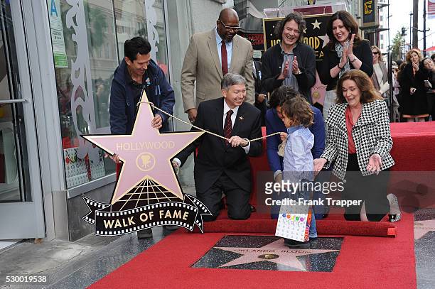 Actor Orlando Bloom pose with guests at the ceremony that honored him with a Star on the Hollywood Walk of Fame.
