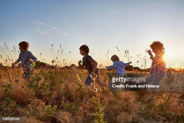 family out walking in the park - children running stock pictures, royalty-free photos & images