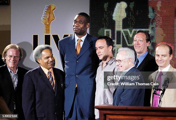 Mayor John F. Street , athlete Dikembe Mutumbo , and musician Dave Matthews are flanked by Live 8 producers during a news conference to announce the...