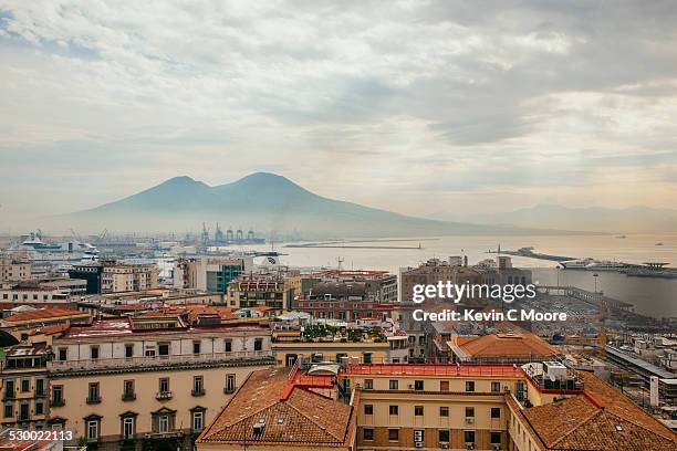 view of mount vesuvius over naples, italy - naples italy foto e immagini stock