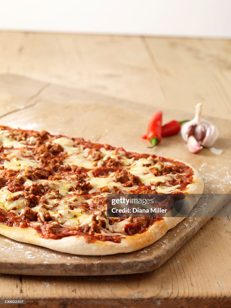 Spicy pizza with red chillies, garlic and cheese