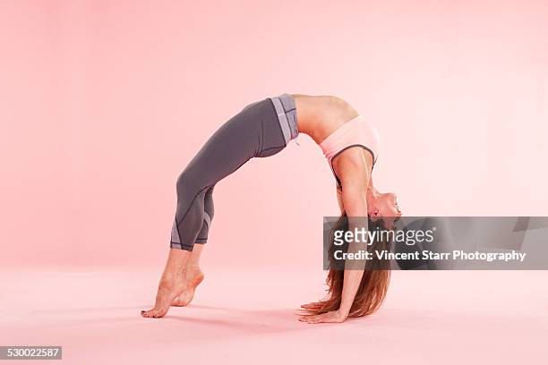 woman practising yoga - head back stock pictures, royalty-free photos & images