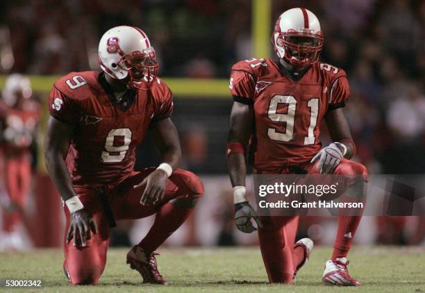 Mario Williams and Manny Lawson of the North Carolina State Wolfpack line up against the Florida State Seminoles during an ACC game at Carter-Finley...