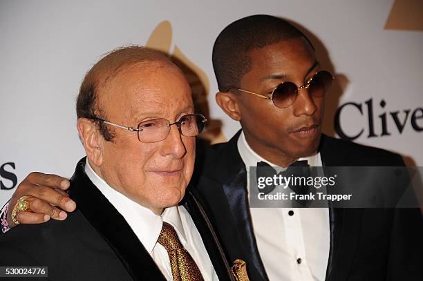 Clive Davis and recording artist Pharrell Williams arrive at the Gala and Salute To Industry Icons honoring Martin Bandier at The Beverly Hilton...