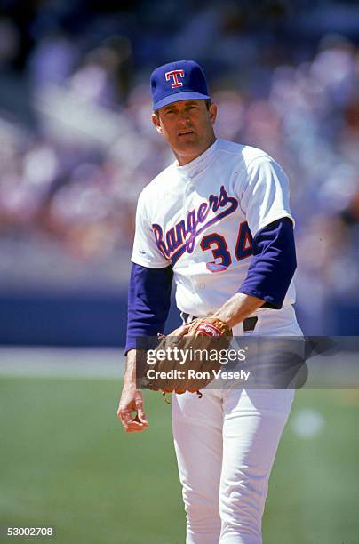 Pitcher Nolan Ryan of the Texas Rangers looks on during a game circa 1989-1993.