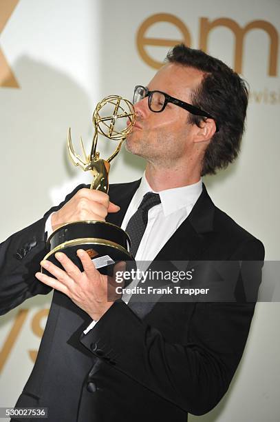 Actor Guy Pearce posing with his award for Outstanding Supporting Actor in a Miniseries or a Movie: "Mildred Pierce" at the 63rd Annual Primetime...